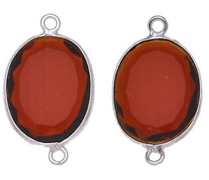 OVALE IRREGOLARE C/BORDO ARG. 925 C/2 ANELLI CIRCA 13*17 MM. CORNIOLA