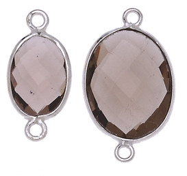 OVALE IRREGOLARE C/BORDO ARG. 925 C/2 ANELLI CIRCA 13*17 MM. QUARZO FUME'