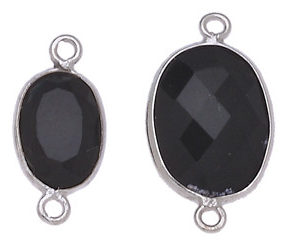 OVALE IRREGOLARE C/BORDO ARG. 925 C/2 ANELLI CIRCA 13*17 MM. AGATA NERA