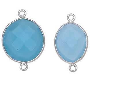 OVALE IRREGOLARE C/BORDO ARG. 925 C/2 ANELLI CIRCA 13*17 MM. AGATA AZZURRO